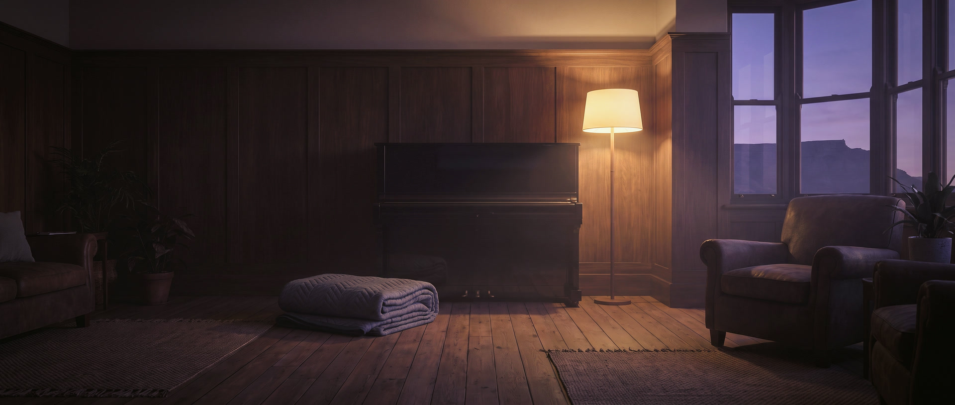 An upright piano standing in a quiet living room at dusk, lit by one warm lamp